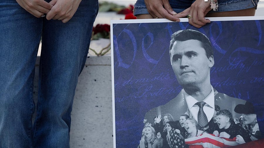 <div class="paragraphs"><p>Jordyn Hackner, president of Turning Point USA's University of Houston chapter,and Lizbeth Aguilar stand behind a poster of conservative activist Charlie Kirk as people mourn following his fatal shooting, at the University of Houston in Houston, Texas, US, September 11, 2025.</p></div>