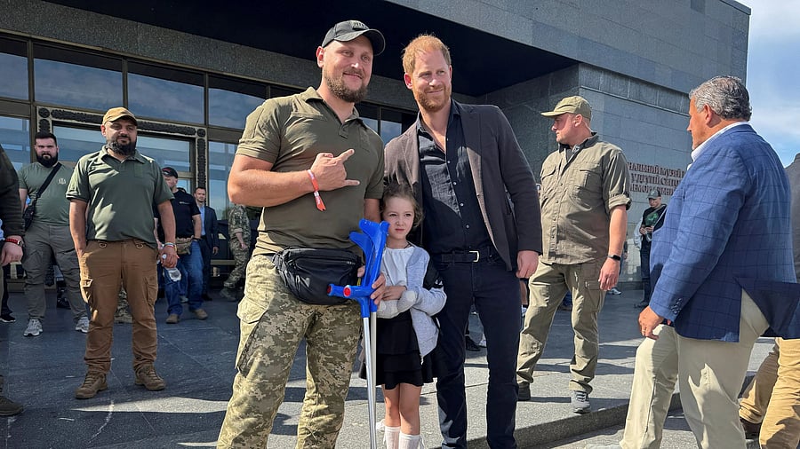 <div class="paragraphs"><p>Britain's Prince Harry poses for a picture with wounded Ukrainian serviceman</p></div>