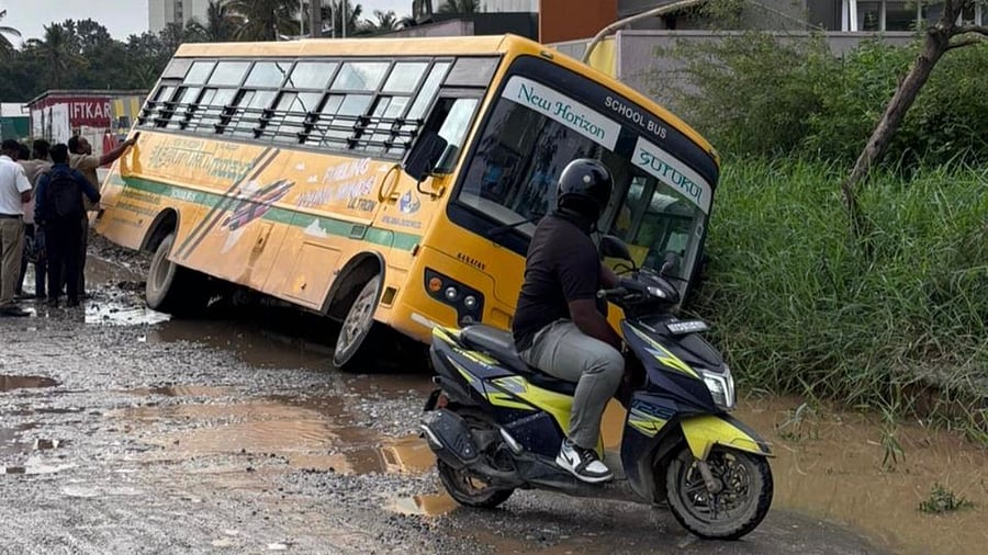 <div class="paragraphs"><p>The&nbsp;school bus which got stuck in a drain on the Balagere Road.&nbsp;</p></div>
