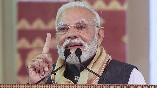 <div class="paragraphs"><p>Prime Minister Narendra Modi addresses a gathering during laying of foundation stone and inauguration of development works, in Darrang, Assam.</p></div>