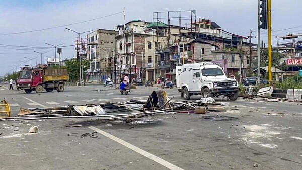 <div class="paragraphs"><p>A road leading to Imphal is blocked by residents amid ongoing protests over ongoing violence, near Imphal.</p></div>