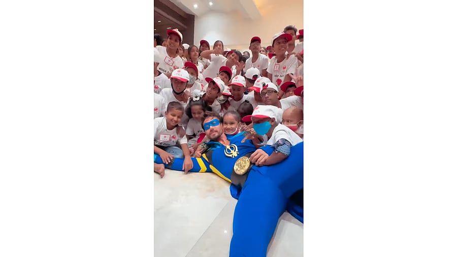 <div class="paragraphs"><p>During the event, he offered roses and bag packs to the children and clicked pictures with them.</p></div>