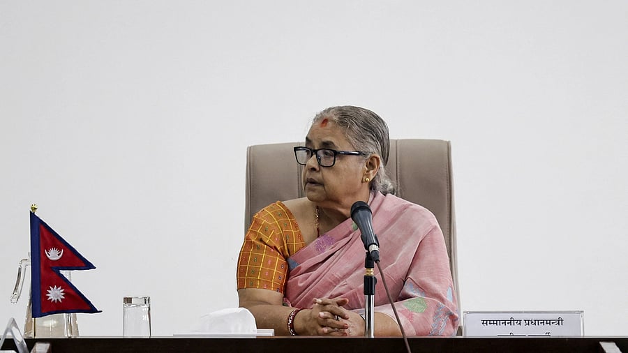<div class="paragraphs"><p>Newly sworn-in interim Prime Minister of Nepal, Sushila Karki, take part in a meeting after assuming the post in her office at Singha Durbar office complex that houses the Prime Minister's office and other ministries, following the protest against anti-corruption triggered by a social media ban, which was later lifted, in Kathmandu, Nepal, September 14, 2025. </p></div>