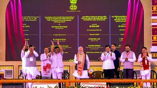 <div class="paragraphs"><p>Prime Minister Narendra Modi with Union Minister Sarbananda Sonowal and Assam Chief Minister Himanta Biswa Sarma during laying of foundation stone and inauguration of developmental works, in Darrang.</p></div>