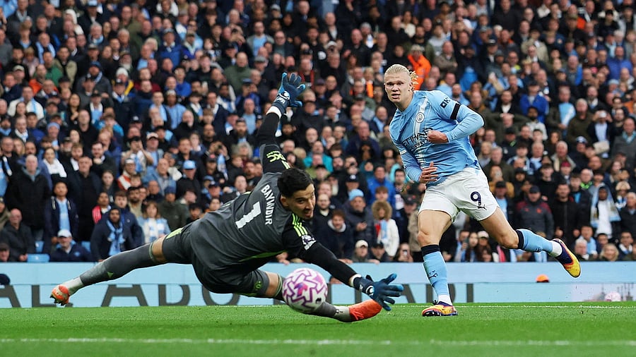 <div class="paragraphs"><p>Manchester City's Erling Haaland scores their third goal past Manchester United's Altay Bayindir.</p></div>