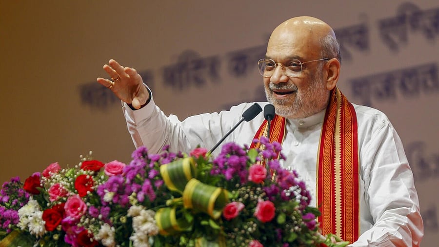 <div class="paragraphs"><p>Union Home Minister Amit Shah addresses a gathering during the fifth 'Akhil Bharatiya Rajbhasha Sammelan' organised on the occasion of 'Hindi Diwas', in Gandhinagar, Gujarat, Sunday, Sept. 14, 2025.</p></div>