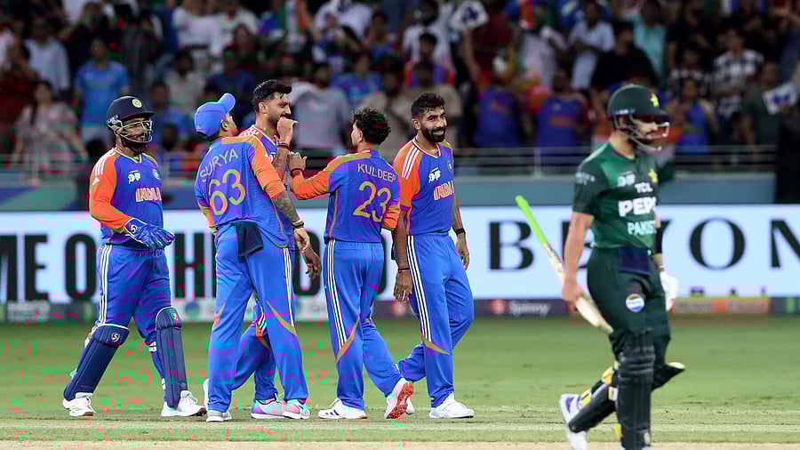 <div class="paragraphs"><p> Kuldeep Yadav celebrates with teammates after taking the wicket of Pakistan's Hasan Nawaz, caught out by Axar Patel </p></div>