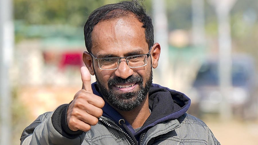 <div class="paragraphs"><p>Journalist Siddique Kappan poses for photos following his release from the Lucknow District Jail, in Lucknow.</p></div>