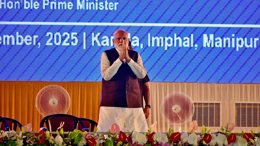 <div class="paragraphs"><p>Prime Minister Narendra Modi greets supporters upon his arrival at a public meeting in Imphal, in the northeastern state of Manipur.</p></div>