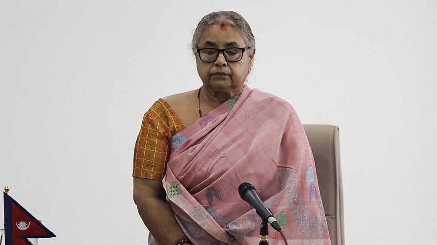 <div class="paragraphs"><p>Newly sworn-in interim Prime Minister of Nepal, Sushila Karki, take part in a moment of silence in memory of people who died in a protest</p></div>