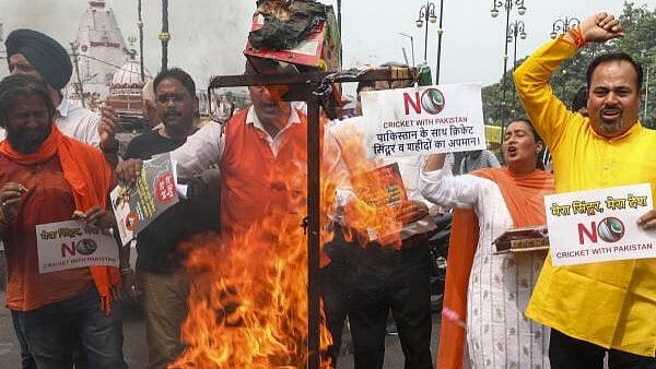 <div class="paragraphs"><p>Shiv Sena (UBT) workers shout slogans during a protest against the India-Pakistan Asia Cup cricket match, in Jammu.</p></div>