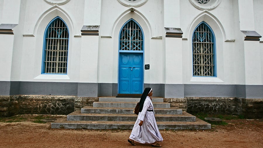 <div class="paragraphs"><p>Representative image of a nun walking past a church.&nbsp;&nbsp;</p></div>
