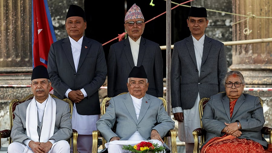 <div class="paragraphs"><p>Nepal's President Ramchandra Paudel, along with Vice President of Nepal Ram Sahaya Prasad Yadav and interim Prime Minister Sushila Karki, poses for a picture with newly appointed Finance Minister Rameshore Khanal, Energy Minister Kulman Ghising, and Home Minister Om Prakash Aryal after administering the oath of office.</p></div>