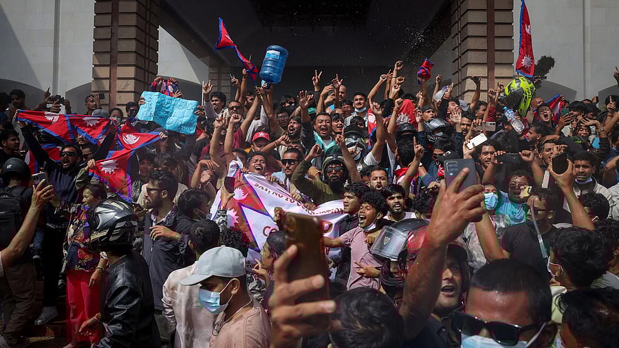 <div class="paragraphs"><p>Demonstrators celebrate at the Parliament complex during a protest against September 8's killing of 19 people after anti-corruption protests.</p></div>
