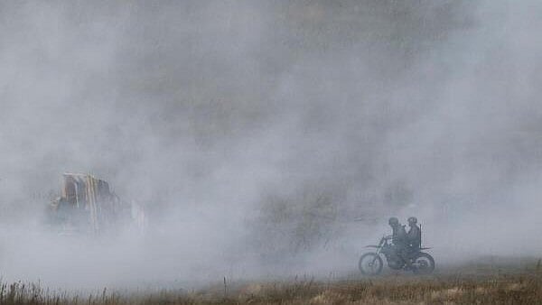<div class="paragraphs"><p>Members of military personnel ride a motorcycle during the joint Russia-Belarus "Zapad-2025" military drills.</p></div>