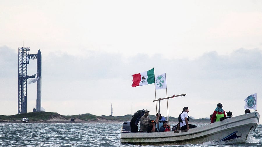 <div class="paragraphs"><p>Environmentalists protest aboard a boat near SpaceX’s Starbase launch site on the south Texas coast.</p></div>
