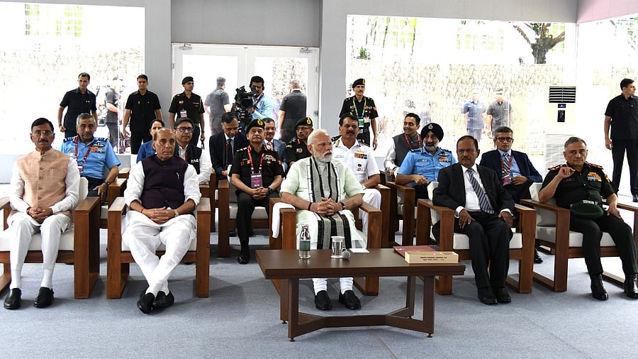 <div class="paragraphs"><p>PM Narendra Modi is flanked by Rajnath Singh (left) and National Security Advisor Ajit Doval at the Combined Commanders Conference in Kolkata.</p></div>