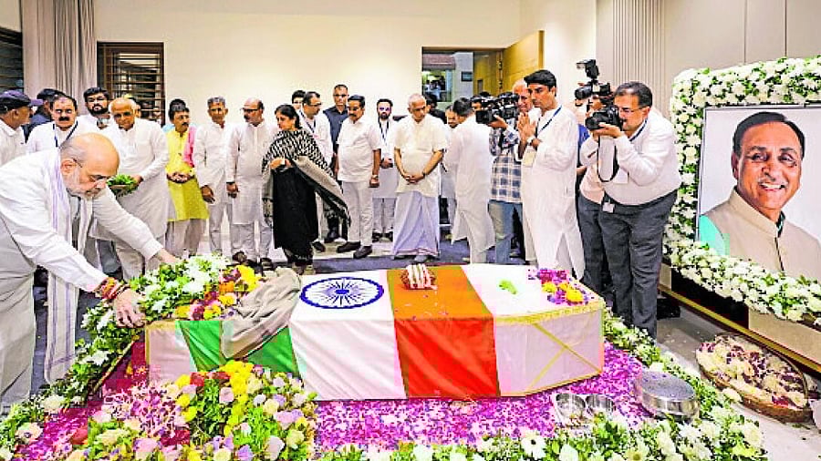 <div class="paragraphs"><p>Union Home Minister Amit Shah pays tribute to former Gujarat Chief Minister and senior BJP leader Vijay Rupani, who died in Ahmedabad plane crash, in Rajkot.</p></div>