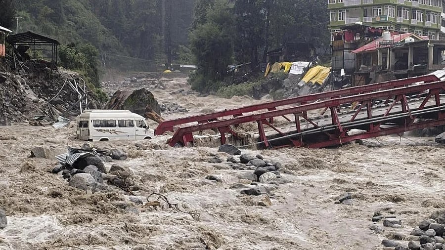 <div class="paragraphs"><p>A vehicle stuck after heavy monsoon rain, at Manali in Kullu district, Himachal Pradesh.</p></div>