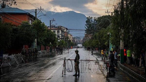 <div class="paragraphs"><p>A Nepali Army soldier guards outside presidential building 'Shital Niwas' in Kathmandu.&nbsp;</p></div>