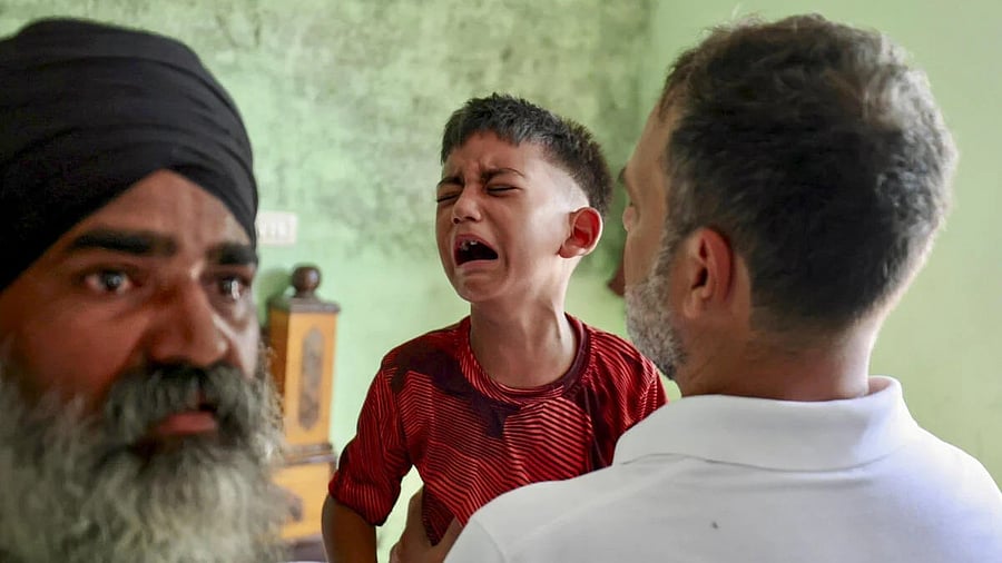 <div class="paragraphs"><p> Congress leader Rahul Gandhi interacting with six-year-old Amritpal Singh at Ghonewal village in Amritsar district of Punjab. </p></div>