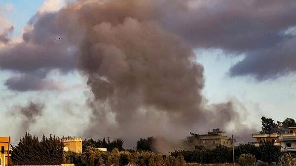 <div class="paragraphs"><p>Smoke billows after a drone strike.</p></div>