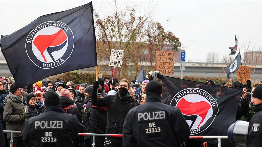 <div class="paragraphs"><p>A person waves an Antifa flag, as people take part in counter-protest against a right-wing demonstration in Berlin, Germany, on December 14, 2024.</p></div>