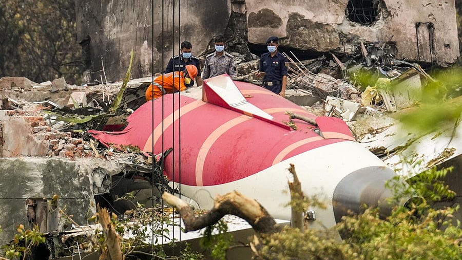 <div class="paragraphs"><p>Wreckage of the crashed Air India plane being lifted through a crane, in Ahmedabad, Gujarat.</p></div>