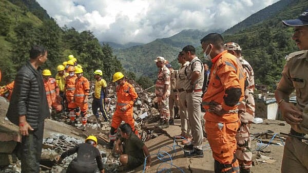 <div class="paragraphs"><p>Security, NDRF and SDRF personnel during a search and rescue operation following landslides and flooding triggered by heavy rain in&nbsp;Uttarakhand's Chamoli district.</p></div>