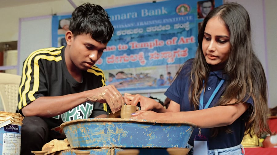 A pottery-making session at the Rangoli Metro Art Centre on Friday. DH Photo/BK Janardhan