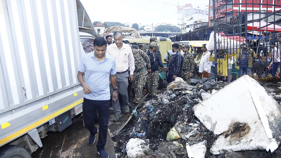 <div class="paragraphs"><p>Officials inspect the KR Market on Saturday. </p></div>