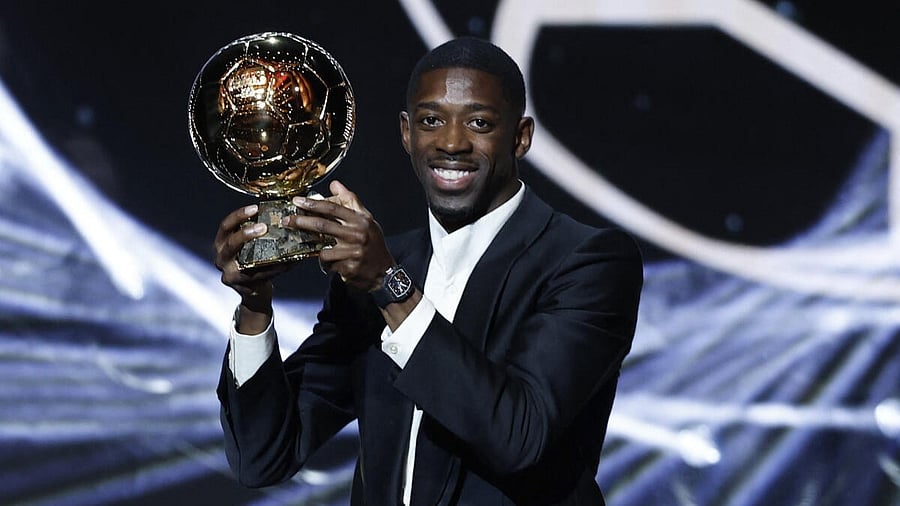 <div class="paragraphs"><p>Paris St Germain's Ousmane Dembele celebrates after winning the men's Ballon d'Or award.</p></div>