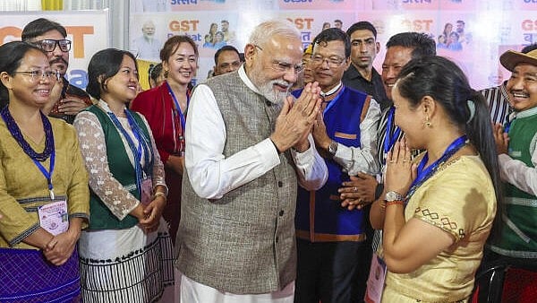 <div class="paragraphs"><p>Prime Minister Narendra Modi interacts with local traders, merchants, and taxpayers during a 'GST Bachat Utsav' event in Itanagar.</p></div>