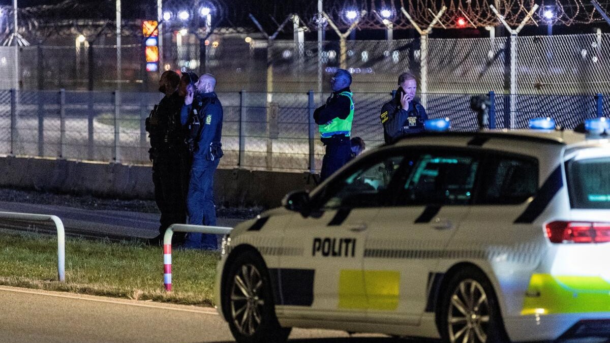 <div class="paragraphs"><p>Police officers stand guard after all traffic has been closed at the Copenhagen Airport due to drone reports in Copenhagen, Denmark</p></div>