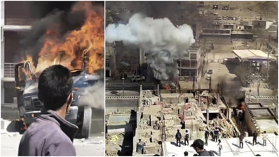 <div class="paragraphs"><p>Smoke and flames billow out after a vehicle was set ablaze by miscreants amid a protest and shutdown, in Leh. </p></div>