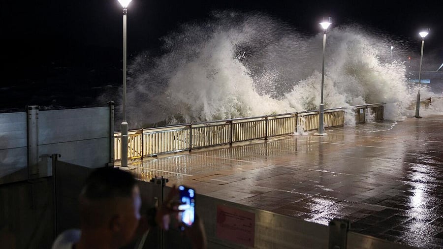 <div class="paragraphs"><p>A resident takes photos of rough waves from the shore before Super Typhoon Ragasa makes its closest approach to Hong Kong, China.</p></div>