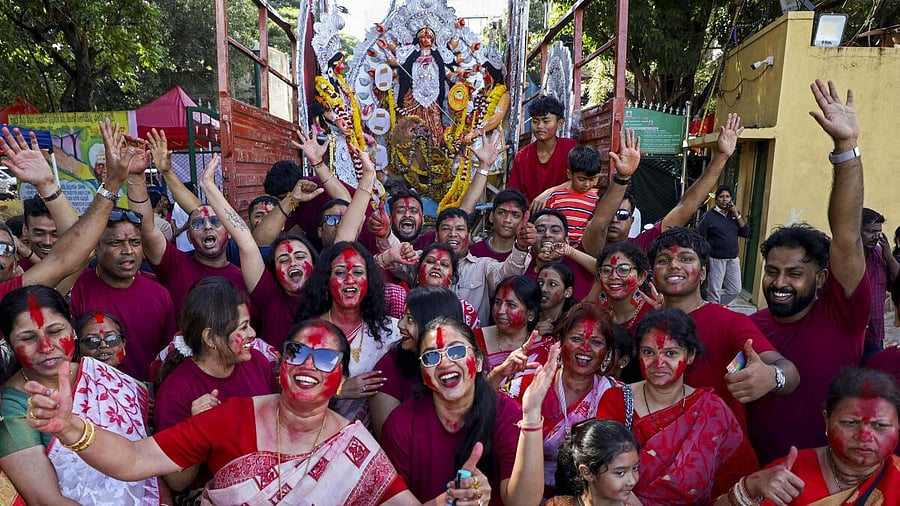 <div class="paragraphs"><p>File photo: People from Bengali community perform a dance during the procession to immersion idols of goddess Durga on the last day of Vijayadashami festival, at Ulsoor Lake in Bengaluru, Karnataka.</p></div>