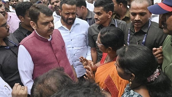 <div class="paragraphs"><p>Maharashtra Chief Minister Devendra Fadnavis interacts with people during inspection of flood-hit areas, in Solapur district, Maharashtra.</p></div>