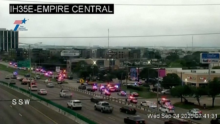 <div class="paragraphs"><p>Police cars and ambulances stand outside a ICE facility where a shooting took place in Dallas, Texas, US.</p></div>