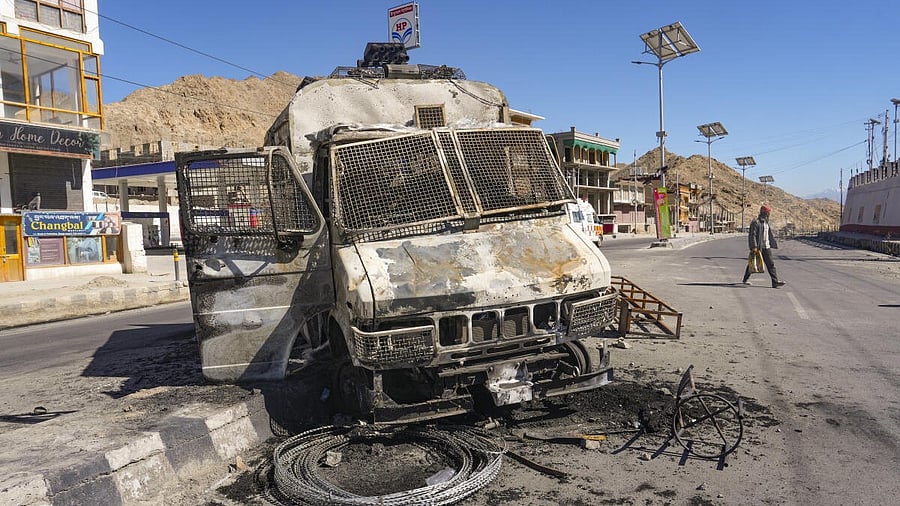 <div class="paragraphs"><p>Charred remains of a vehicle lies in the aftermath of violent clashes between demonstrators and police during a protest demanding statehood for Ladakh, outside BJP headquarters building, in Leh, Thursday, Sept. 25, 2025. </p></div>