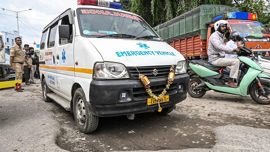 <div class="paragraphs"><p>An ambulance moves through a pothole-ridden road in Bengaluru. </p></div>