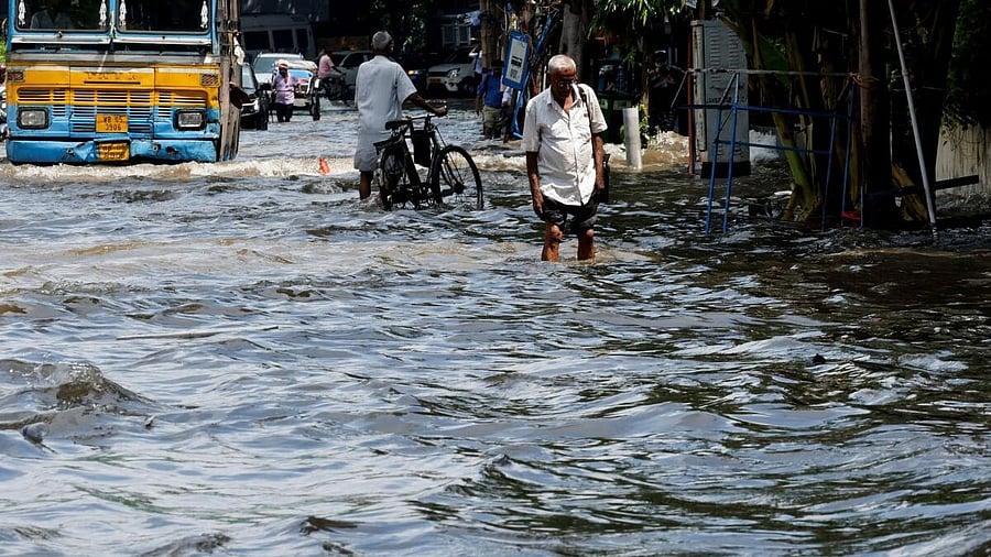 <div class="paragraphs"><p>People wade through a waterlogged road after heavy rainfall in Kolkata, India, September 24, 2025.</p></div>