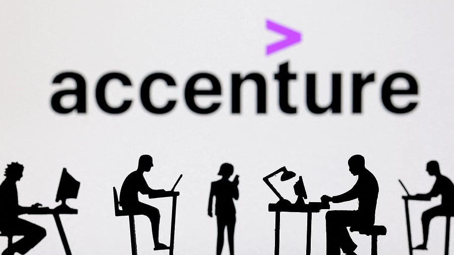 <div class="paragraphs"><p>FILE PHOTO: Figurines with computers and smartphones are seen in front of Accenture logo in this illustration taken, February 19, 2024. </p></div>