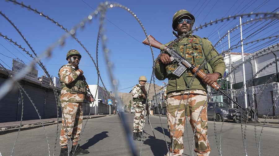 <div class="paragraphs"><p>Security personnel stand guard during a curfew after recent protests for statehood turned violent leaving four people dead and 90 others injured, in Leh, Ladakh.</p></div>