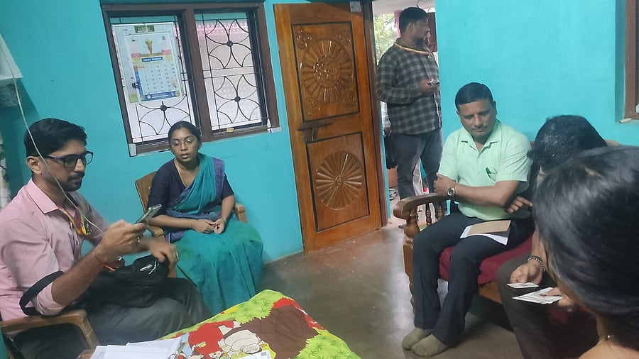 An enumerator uploads data on the app during the social and educational survey at Karwar in Uttara Kannada district.