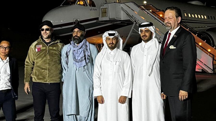 <div class="paragraphs"><p>Amir Amiri, who had been detained in Afghanistan since December 2024, poses for a picture alongside Adam Boehler, the U.S. special envoy for hostage response, Sebastian Gorka, the deputy assistant to the U.S. president and senior director for counterterrorism, Qatari diplomats and others before boarding a plane in Kabul Afghanistan, September 28, 2025 in this handout image.</p></div>