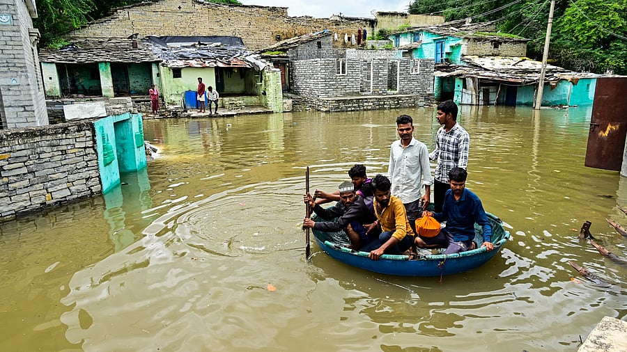 <div class="paragraphs"><p>Residents are shifted on a coracle after the waters of River Bhima marooned Kobala village of Jewargi taluk in Kalaburagi district. </p></div>