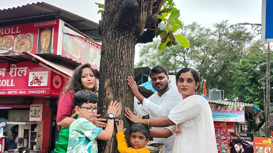 <div class="paragraphs"><p>Tree lovers in a 'Chipko' movement at Vashi to express love for trees being chopped to clear view for hoardings. </p></div>