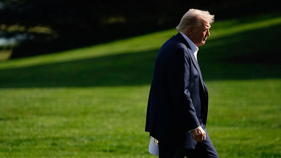 <div class="paragraphs"><p>US President Donald Trump walks as he returns to the White House in Washington, DC, US.</p></div>