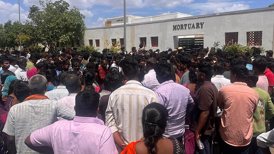 <div class="paragraphs"><p>People waiting outside mortuary after the stampede.</p></div>